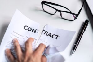 Business woman tearing contract at her office, Breaking contract concept